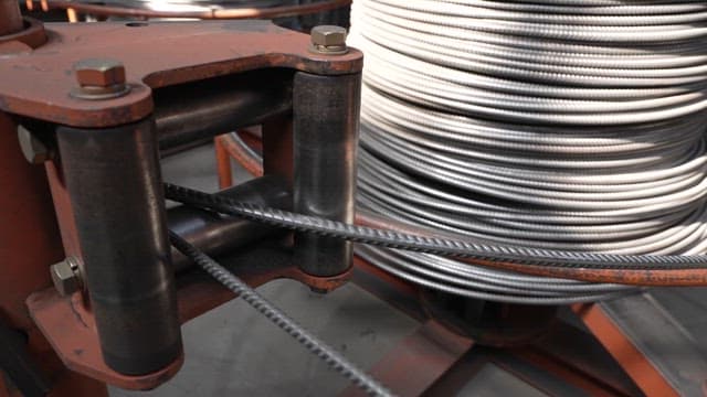 Metal wire being processed in a factory