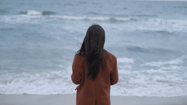 Person standing by the ocean