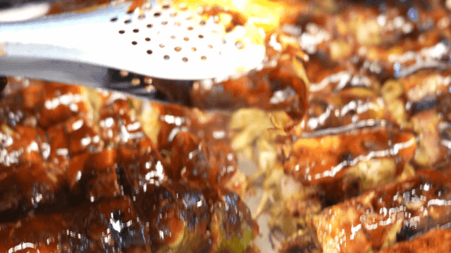Torch for grilling sauce-coated pork belly rolls