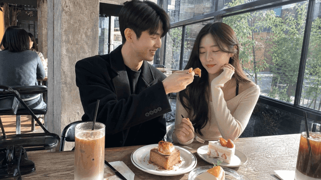 Couple eating dessert at cafe