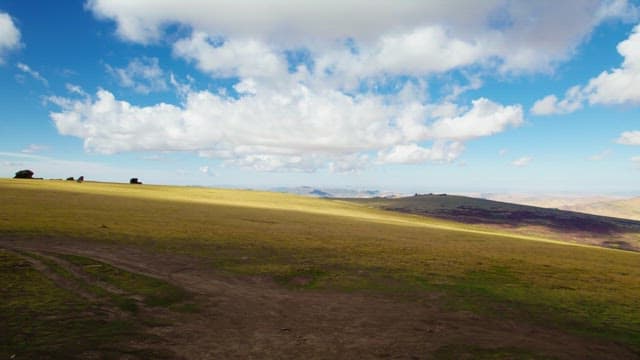 Hiker Exploring a Natural Archway in Mongolia