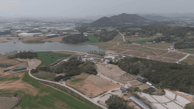 Large farmland with rivers and hills