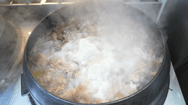 Beef boiling in cauldron