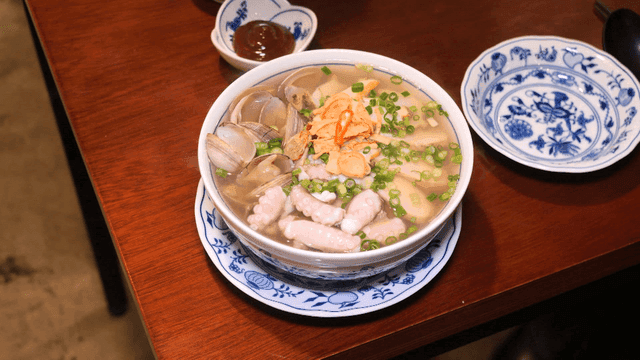Seafood nourishing rice noodles served on wooden table