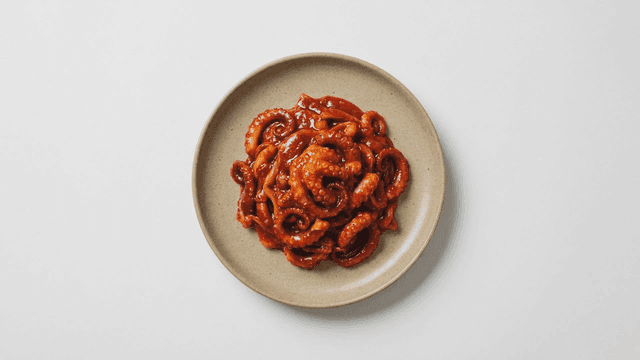 Spicy stir-fried octopus on a plate