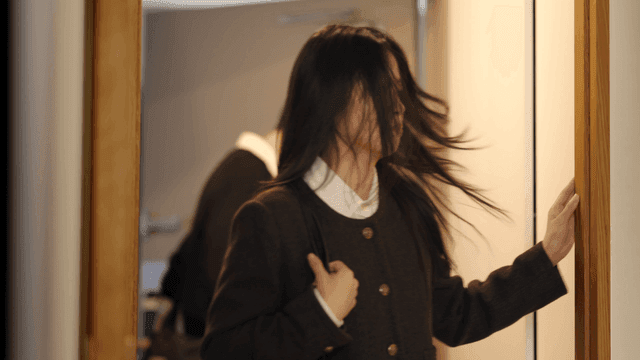 Couple entering home separately with gloomy expressions