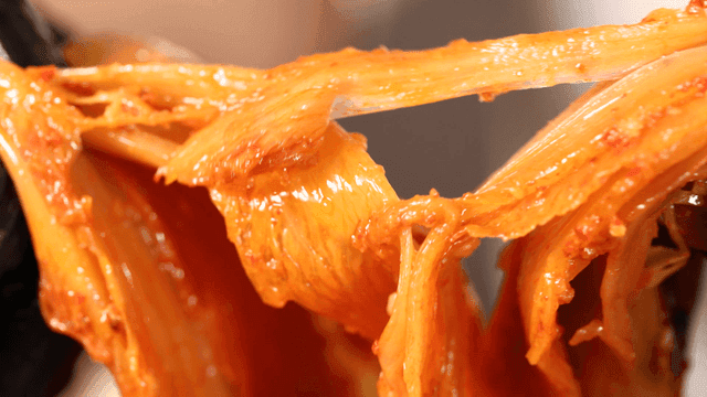 Kimchi stew that tears apart with gloved hands