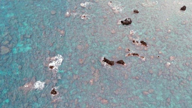 Rocky shoreline with clear blue water