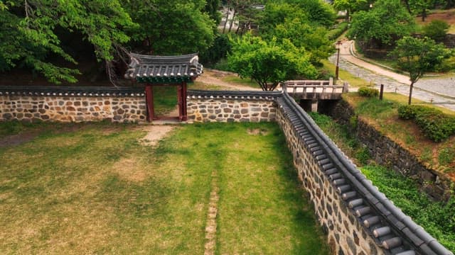 Traditional hanok village surrounded by lush trees