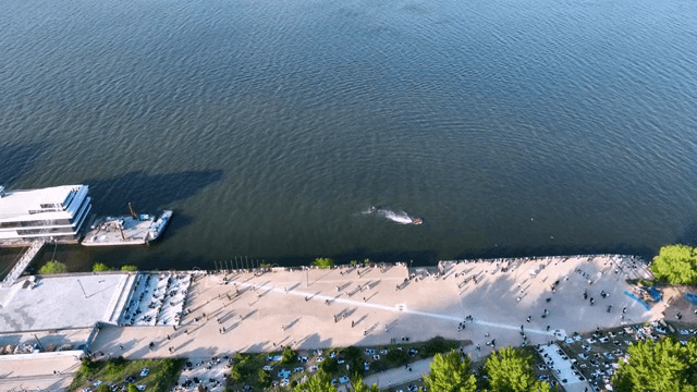 Bustling riverside park with city views