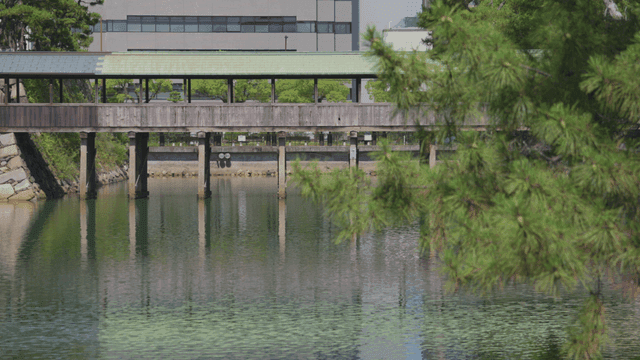 Traditional wooden bridge over a calm river