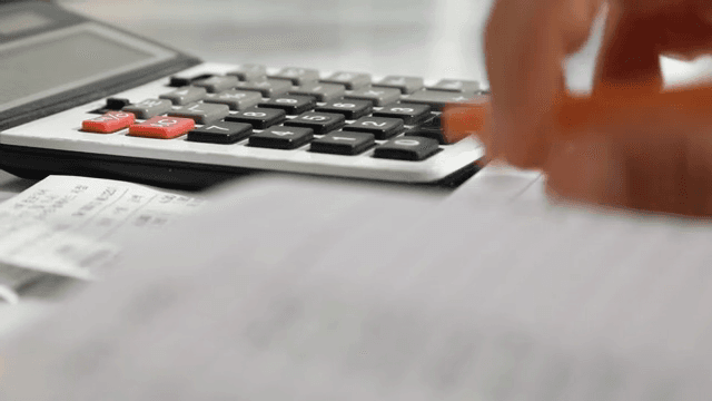 Calculating expenses with a calculator