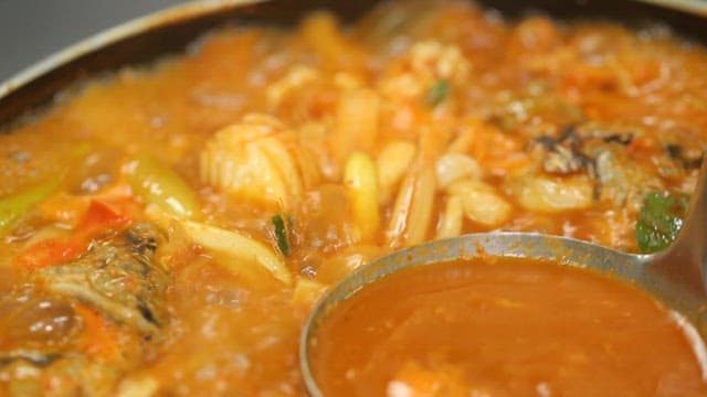 Spicy shaggy sea raven stew boiling in a pot