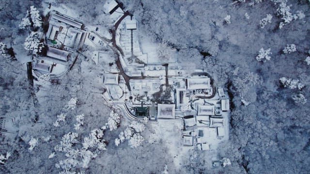 Snow-covered traditional Korean temple