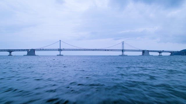 Long Bridge Over Calm Waters at Dusk