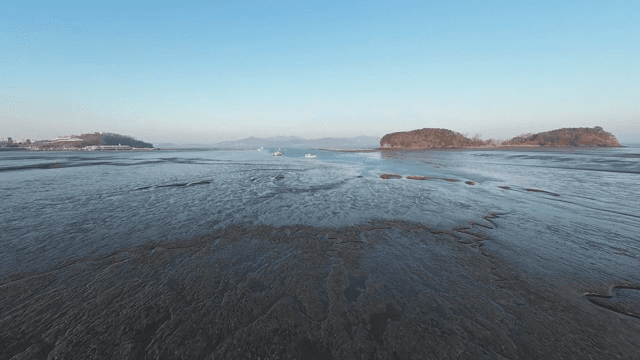Vast mudflat with distant islands