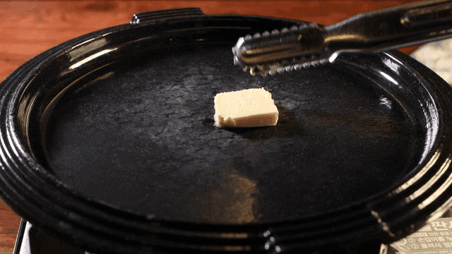 Butter melting on a hot griddle