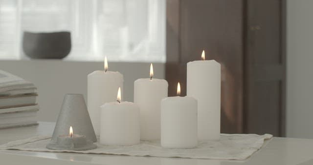 Candlelights Gently Swaying in a Cozy Room