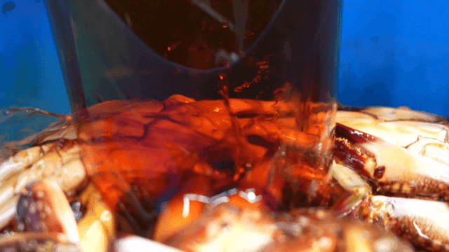 Soy sauce poured over fresh crab