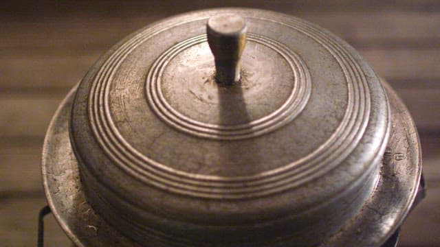 Simmering Traditional Chicken Soup in Small Cauldron