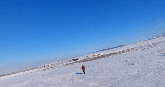 Person walking in a snowy landscape