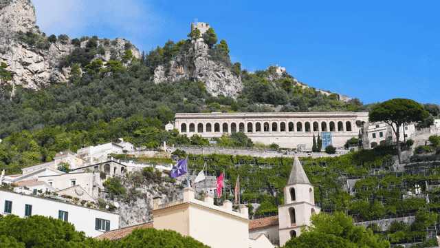A scenic hillside with historic buildings