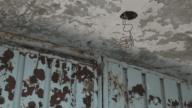 Old rusty ceiling with exposed wires