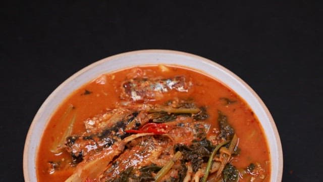 Warm and appetizing young radish and saury stew plated in a bowl