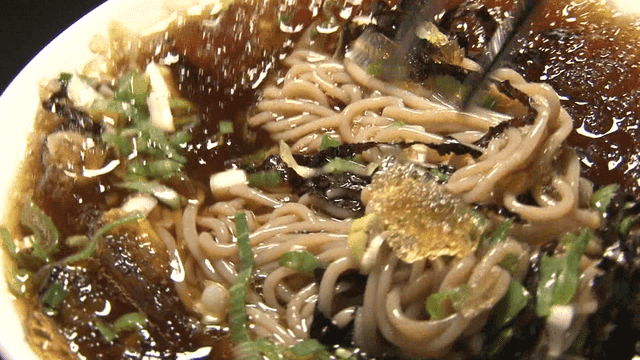 Soba noodles stirred with chopsticks
