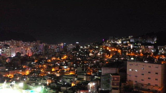 View of residential area at night illuminated by lights