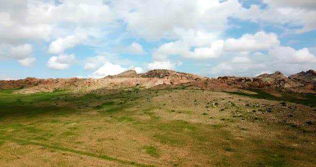 Rocky hills under a cloudy sky