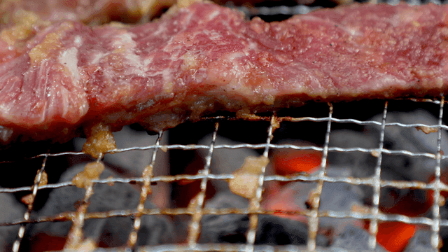 Garlic-marinated beef short ribs grilled over flames