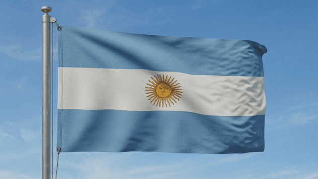 Argentinian flag waving under a clear sky