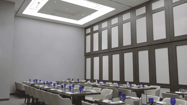 Banquet hall neatly set with tableware