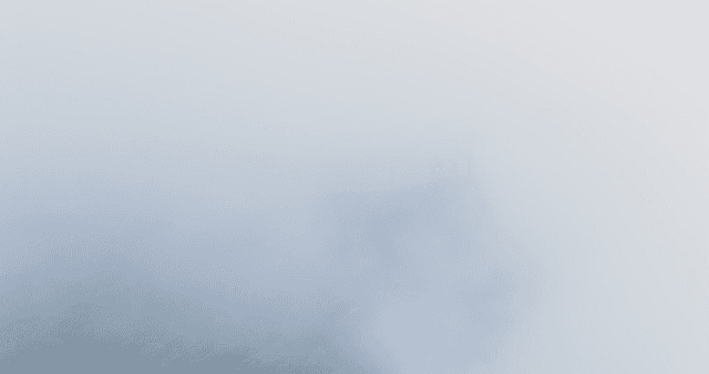 Misty mountain landscape with towers