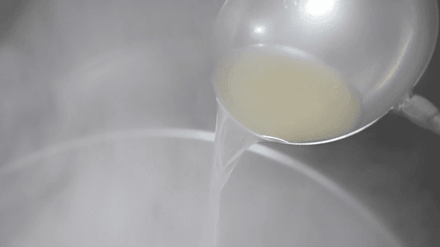 Ladle for pouring broth into pot of boiling