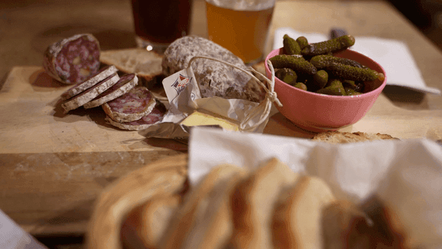 Simple European meal with bread, pickles, and sausages