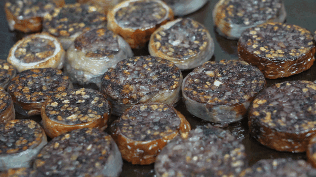 Grilling makchang sundae on griddle