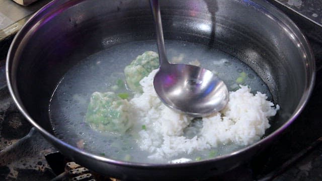 Cooking rice and dumplings in a pot