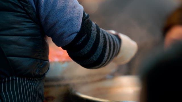 Tteokbokki cooked in a large pot sold at Gwangjang Market