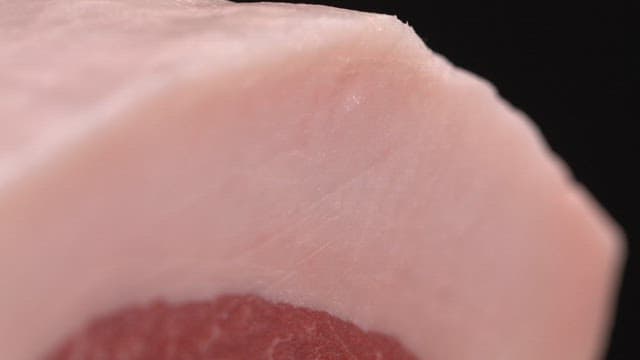 Close-up of raw pork with fat layers