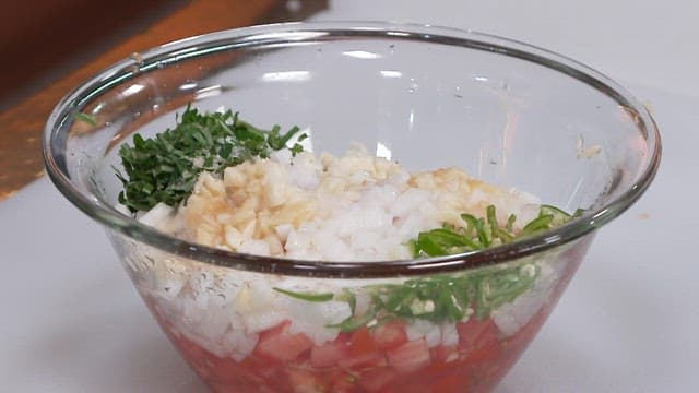 Fresh Ingredients for a Homemade Salsa in a Glass Bowl