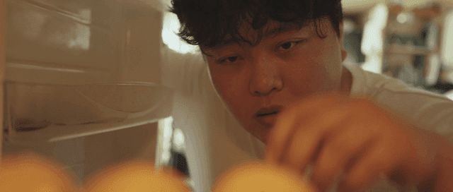 Person looking inside a refrigerator