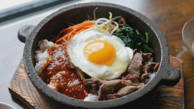 Stone pot bibimbap with eggs and vegetables