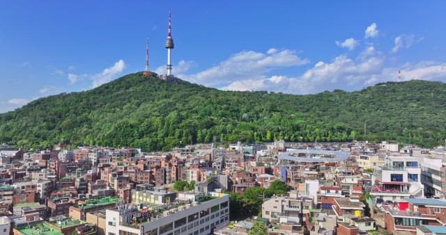 Cityscape with towers and hills