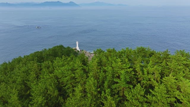 Lighthouse on a rocky coast with ocean view