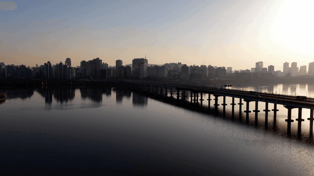 Bridges over river and city skyline