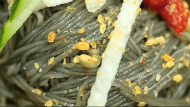 Close-up of cold buckwheat noodles with raw pollack with toppings