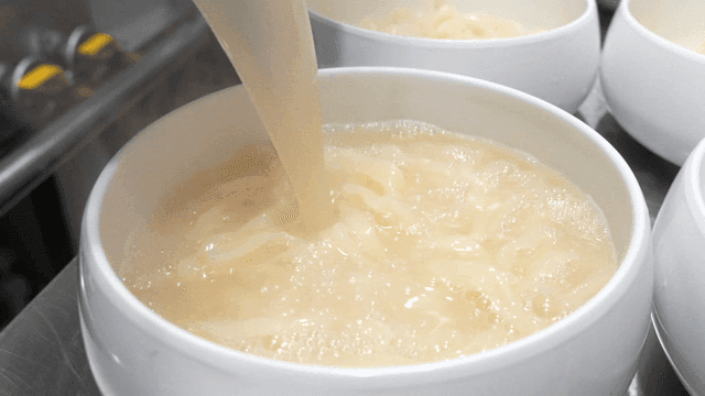 Chicken kalguksu with broth poured into bowl