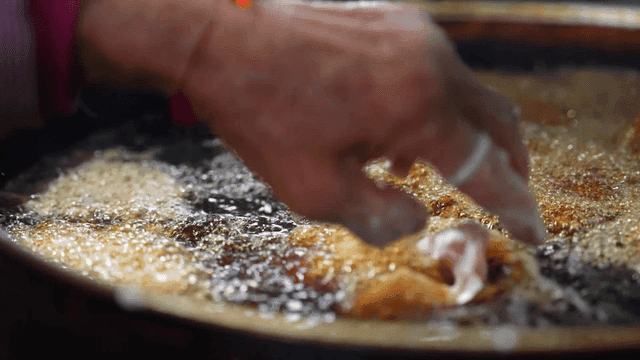 Chicken fried in hot oil